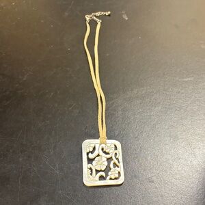 Carved Mother of Pearl Floral Pendant on a Suede Cord
